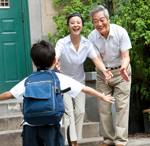 grandson running toward his grandparents life insurance for retirement