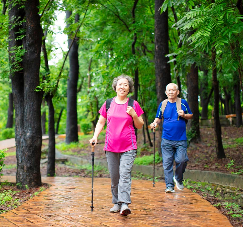 senior couple walking in park annuity income